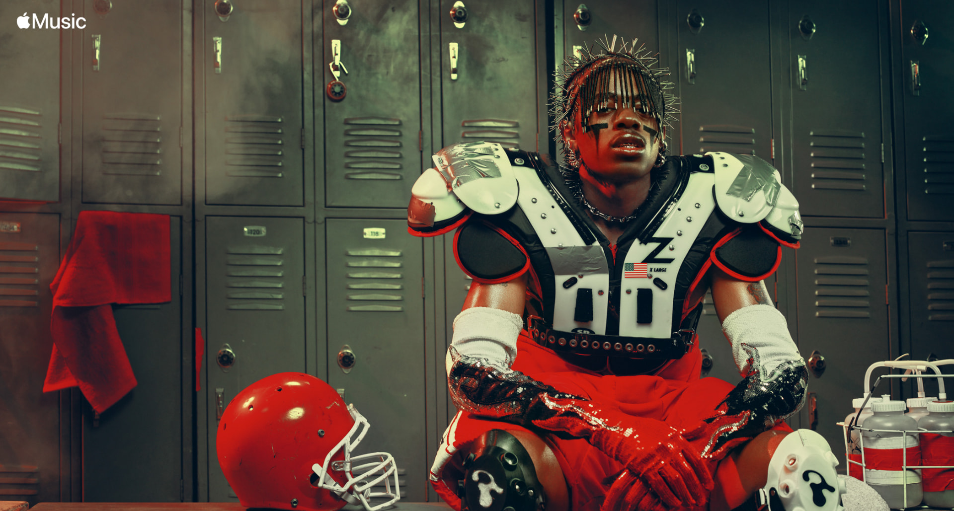 Teezo Touchdown — Apple Music seated locker portrait in red football gear