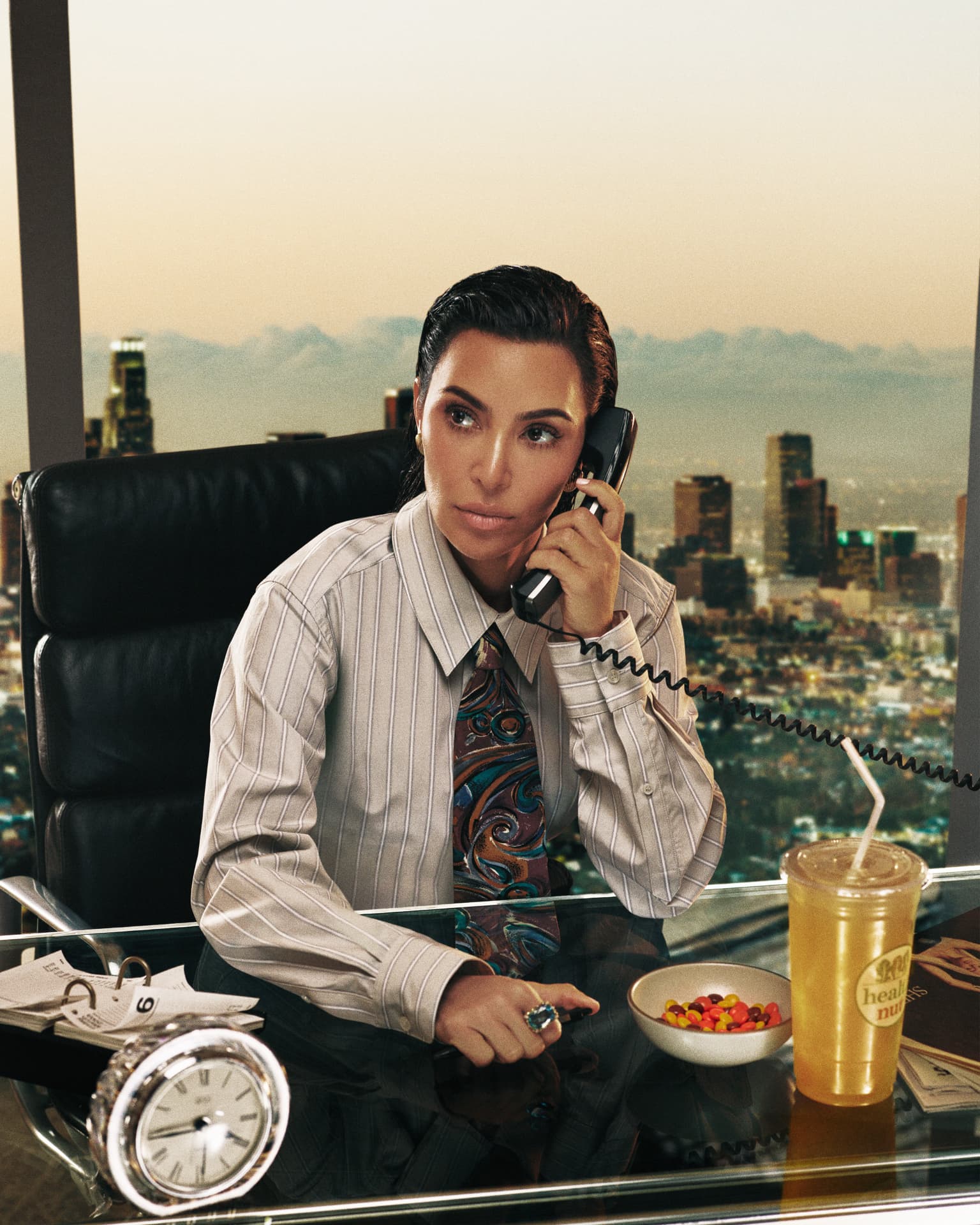 Kim Kardashian — GQ portrait at a desk on the phone overlooking Los Angeles
