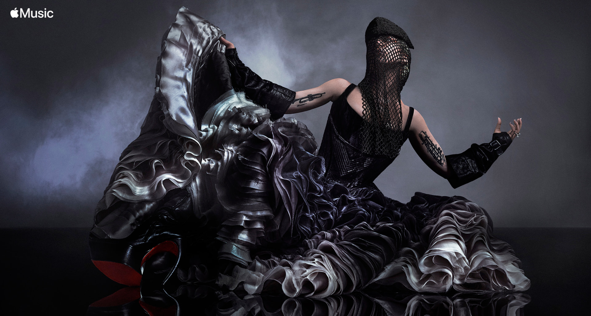 Lady Gaga — Apple Music portrait in ruffled black gown and mesh mask