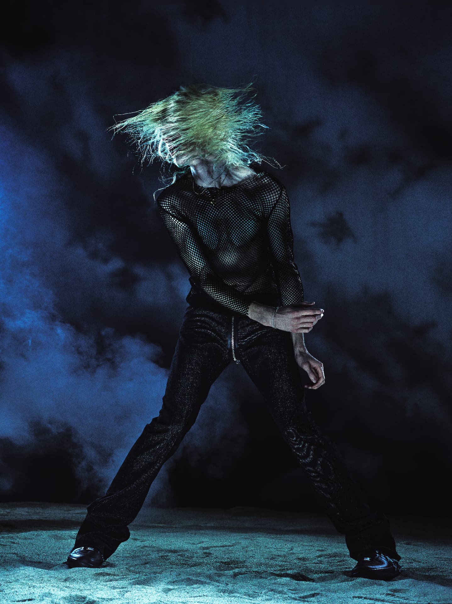 2Hollis — figure whipping hair in moody blue light