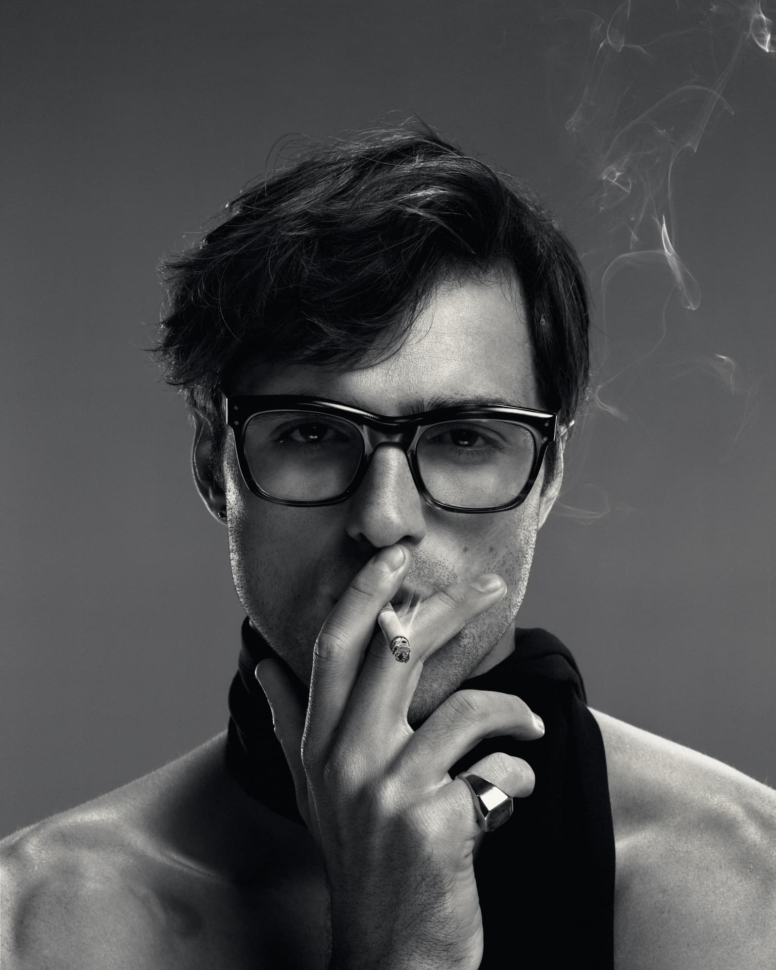 Jacob Elordi — black and white close-up smoking with glasses