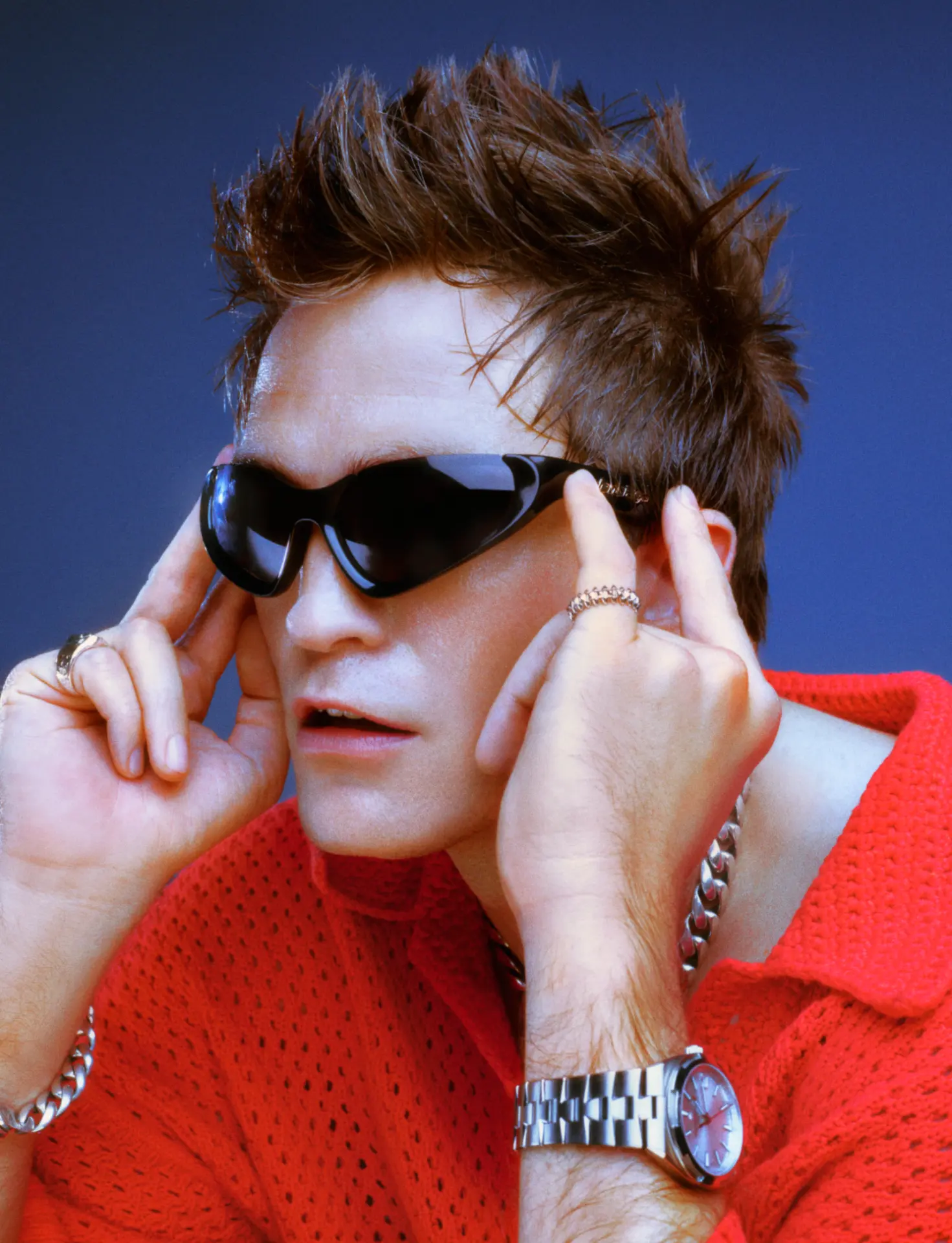 Rob Pattinson GQ — red mesh top against blue backdrop