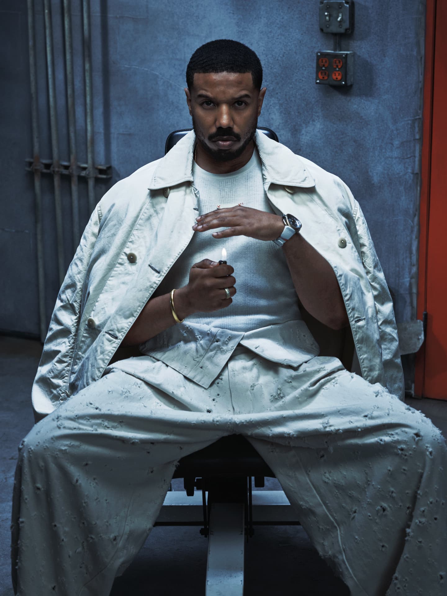 Michael B Jordan — seated holding a lighter