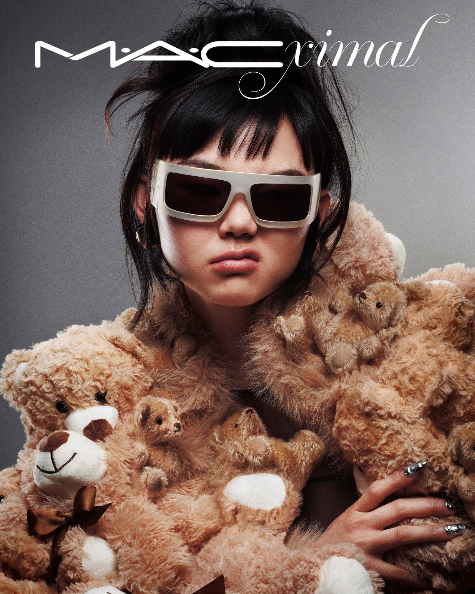 MACximal — model holding teddy bears in oversized sunglasses