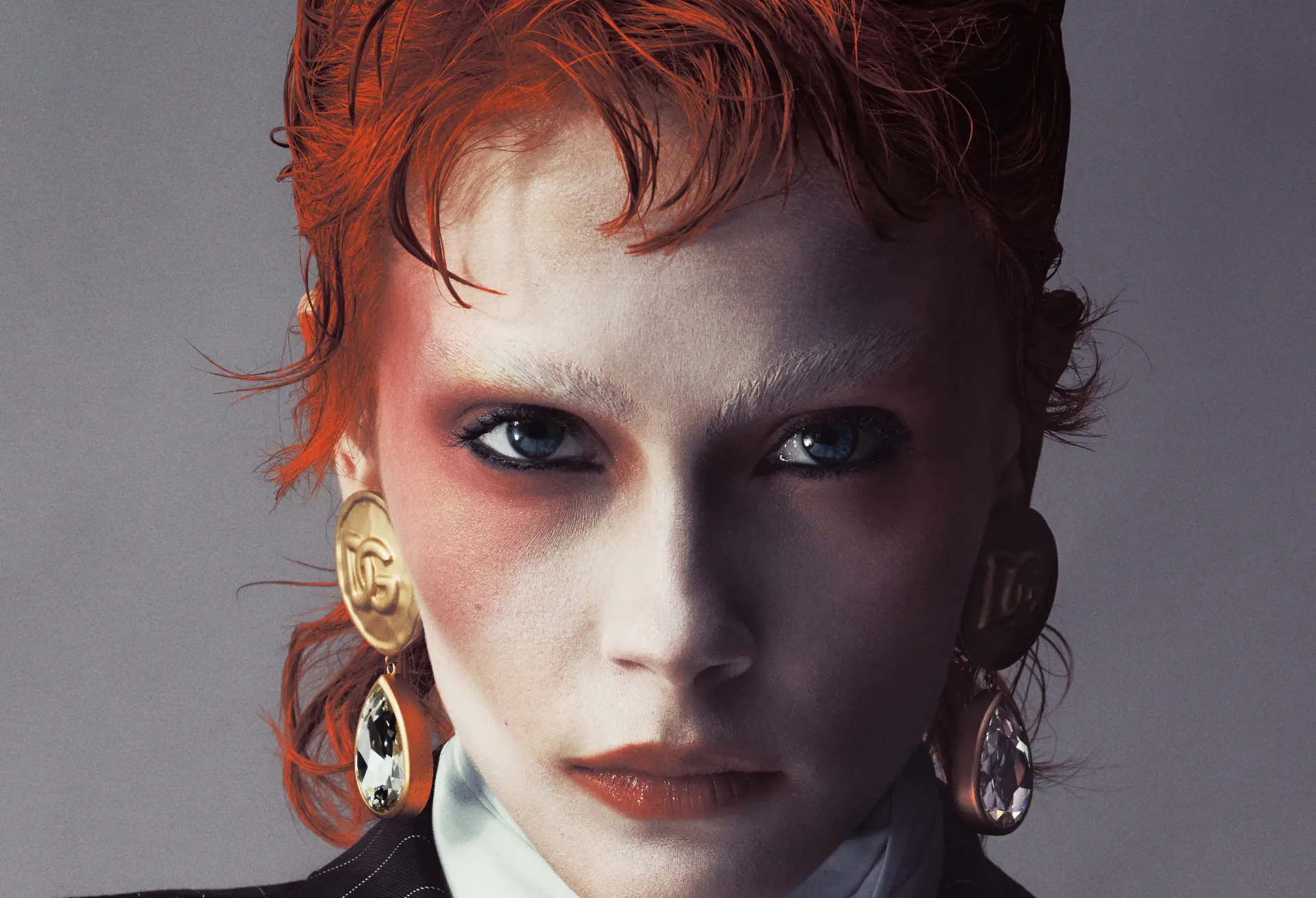 ZIGGY — close-up portrait with gold and crystal earrings