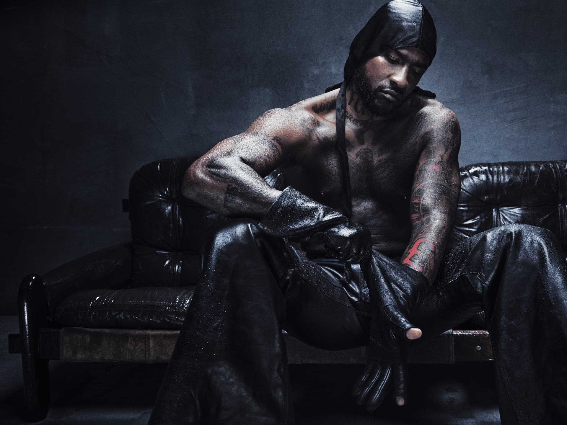 SKEPTA x GQ MOTY — seated shirtless portrait on leather sofa