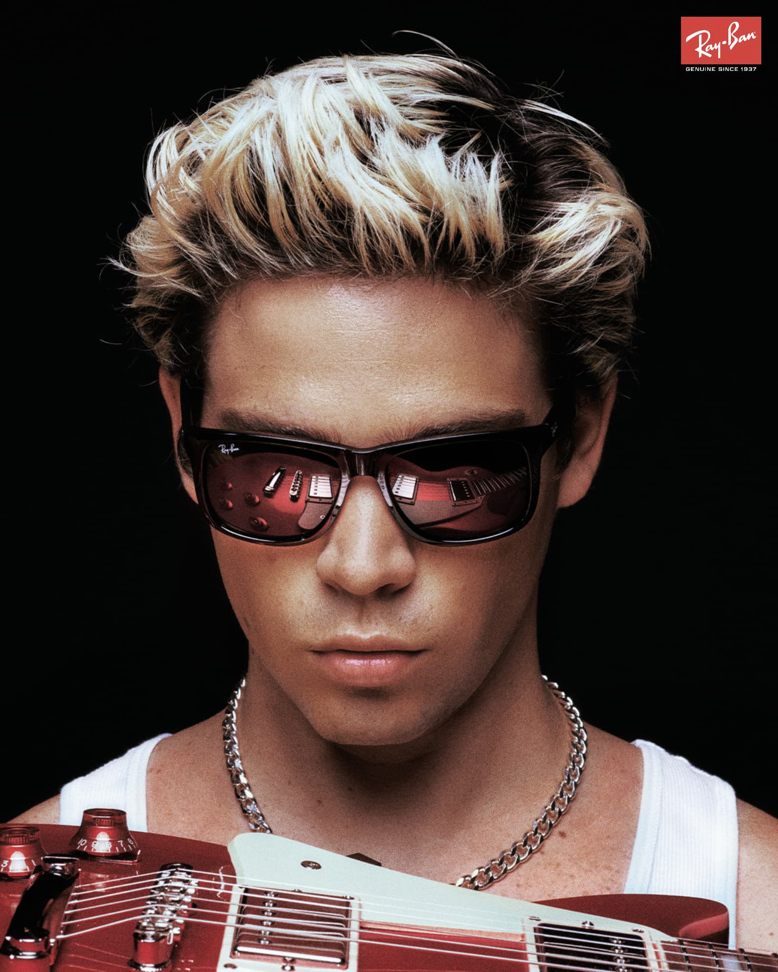 RayBan Holiday Campaign — blonde figure with red sunglasses and electric guitar