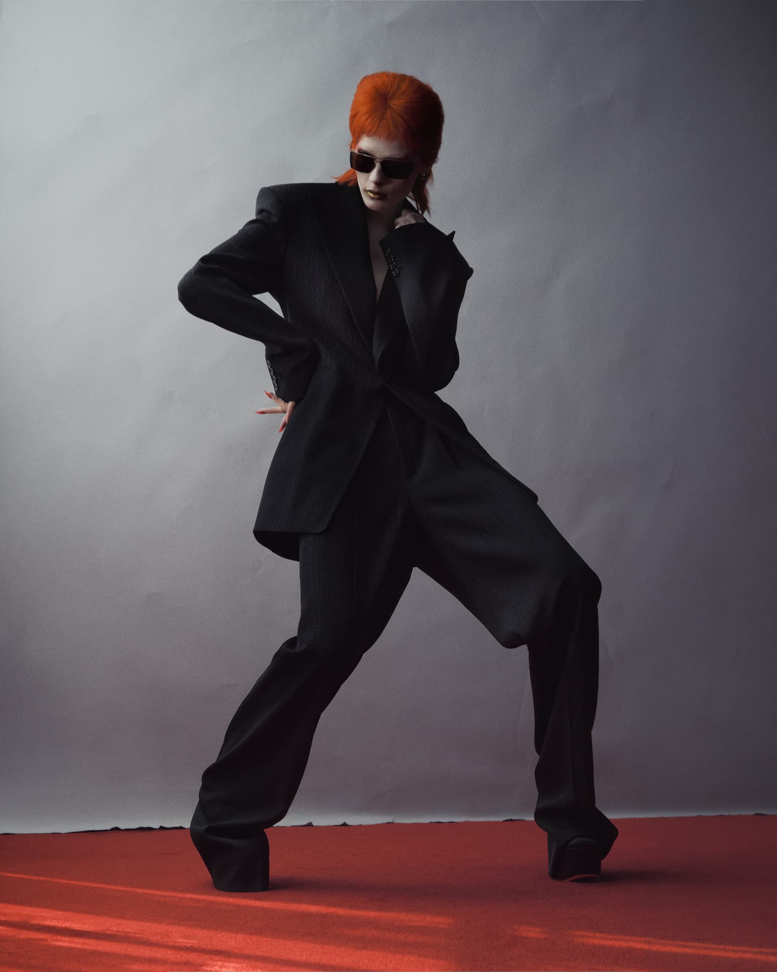 ZIGGY — black suit and sunglasses with wide stance