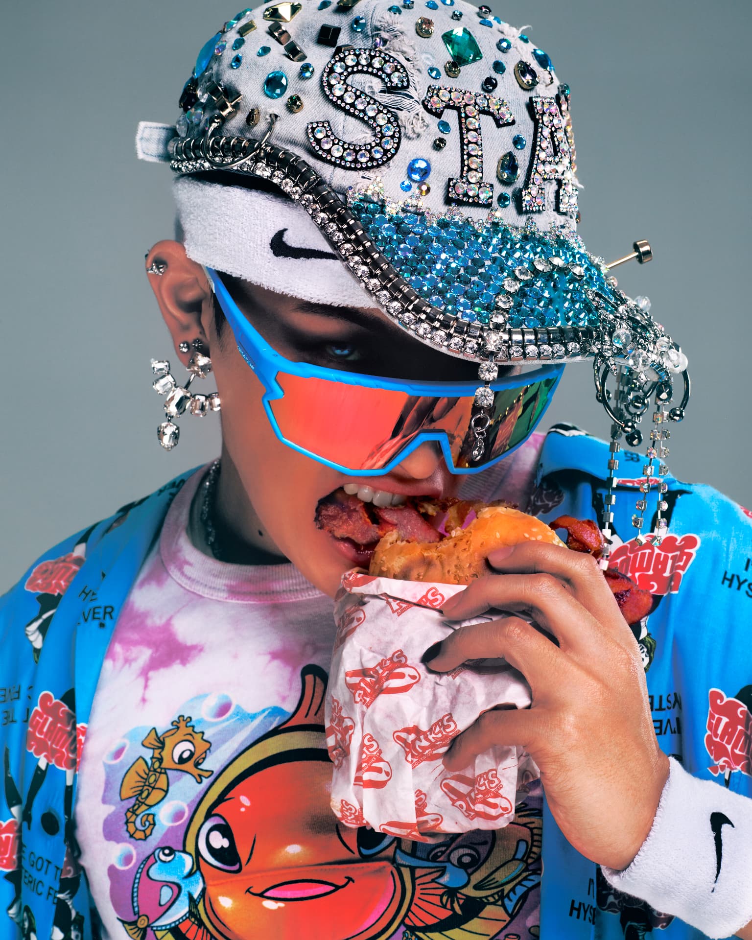 ATEEZ — close-up in crystal-embellished cap and reflective visor