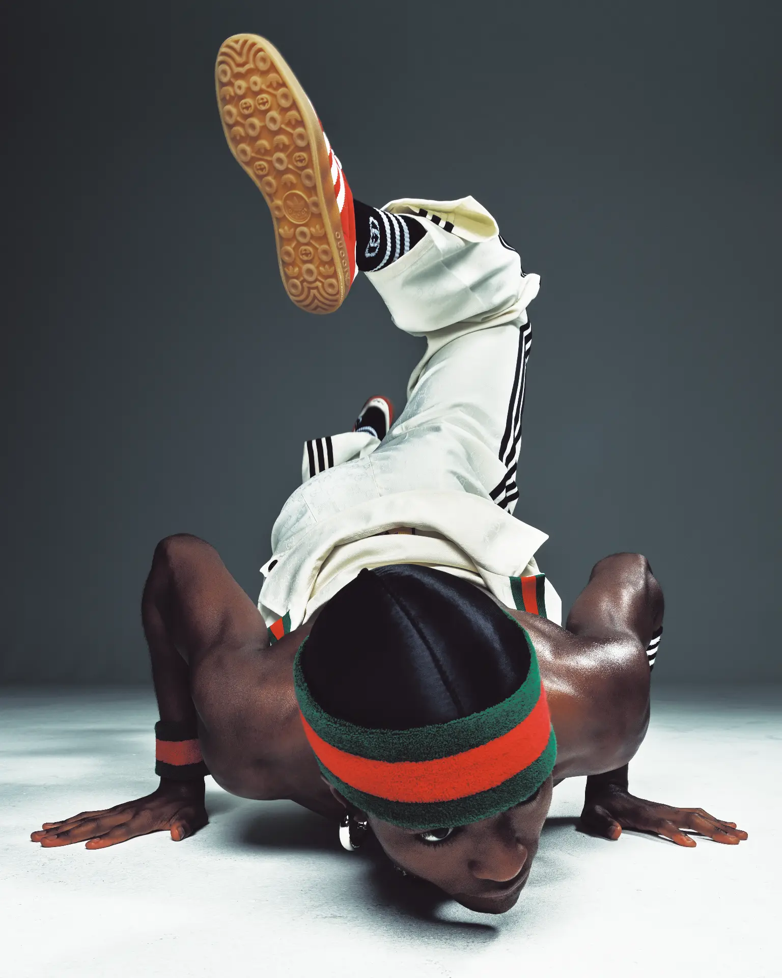 DUST Magazine — Alton Mason breakdance freeze in white tracksuit and red trainers