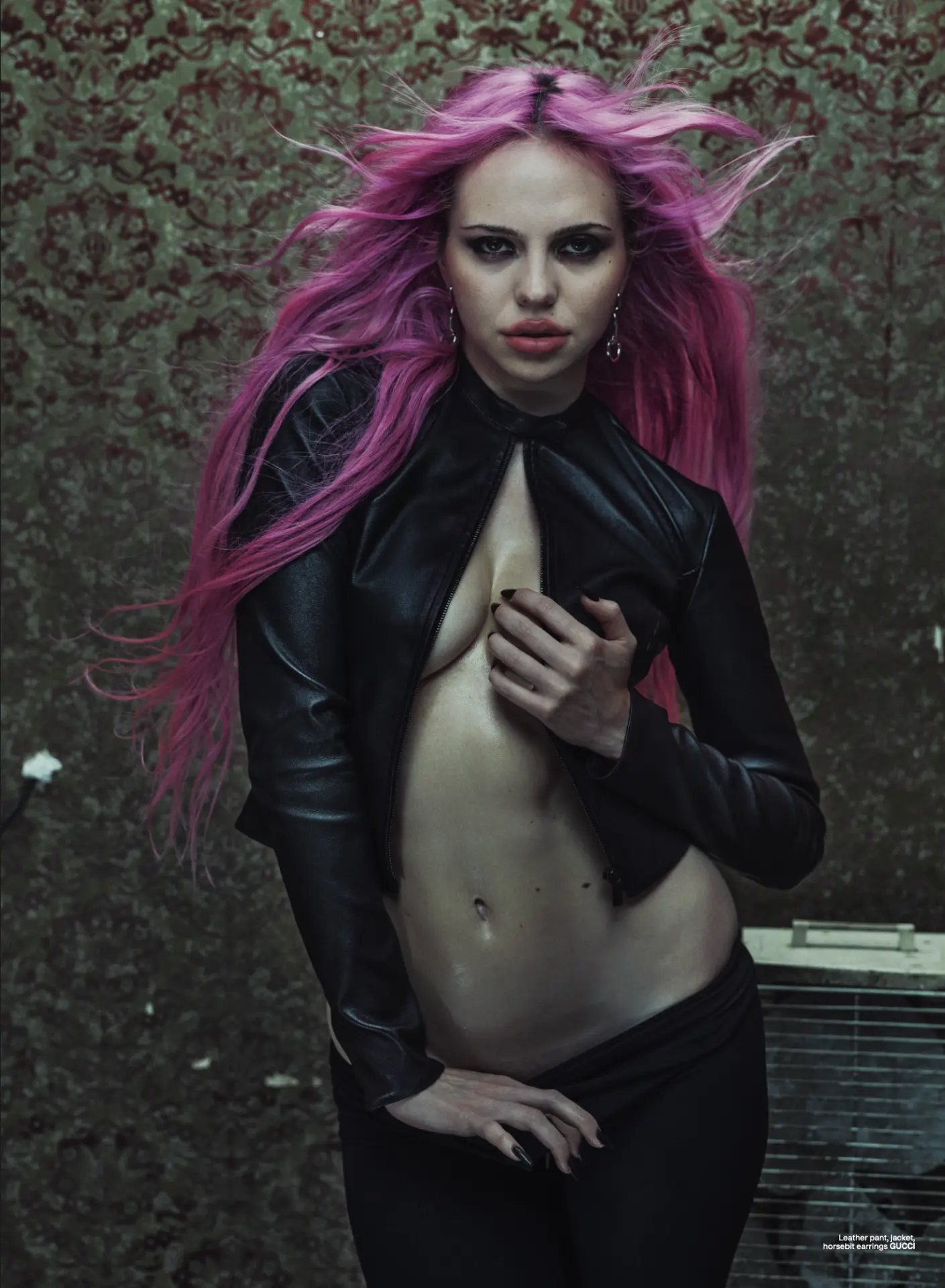 ADÉLA — portrait in black leather jacket with pink hair against damask wallpaper