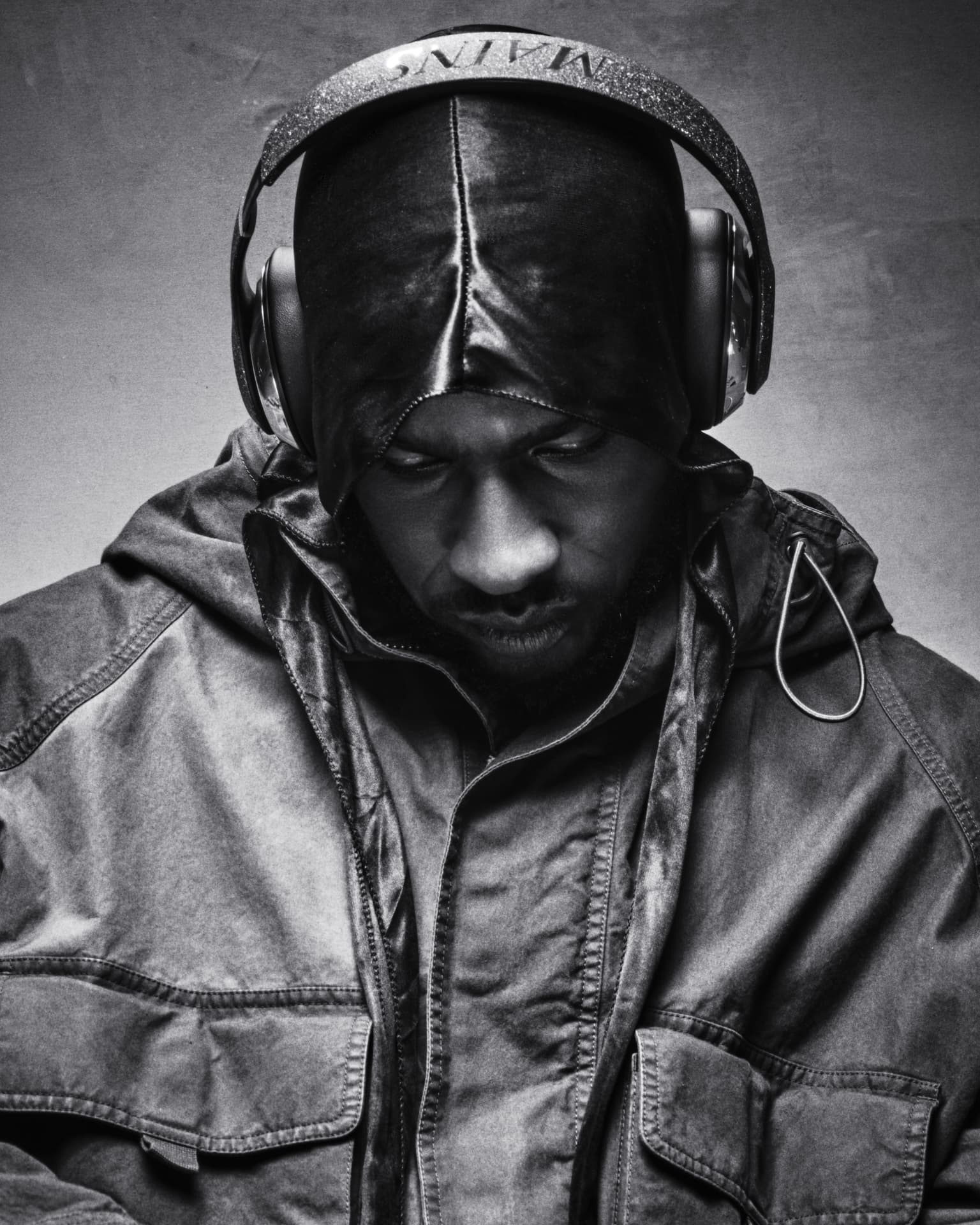 SKEPTA x GQ MOTY — black-and-white portrait in hood and headphones