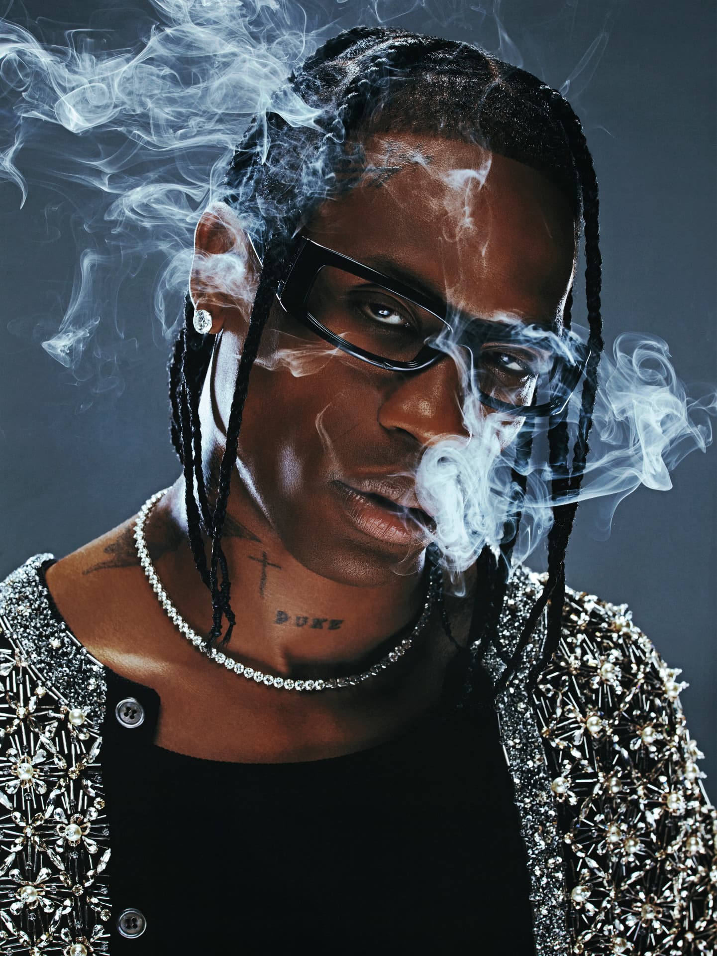 Travis Scott — portrait with smoke and embellished jacket