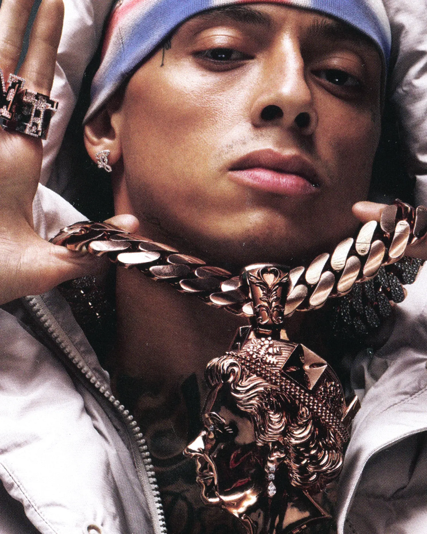 Central Cee — portrait in Union Jack beanie with heavy gold chain and rings