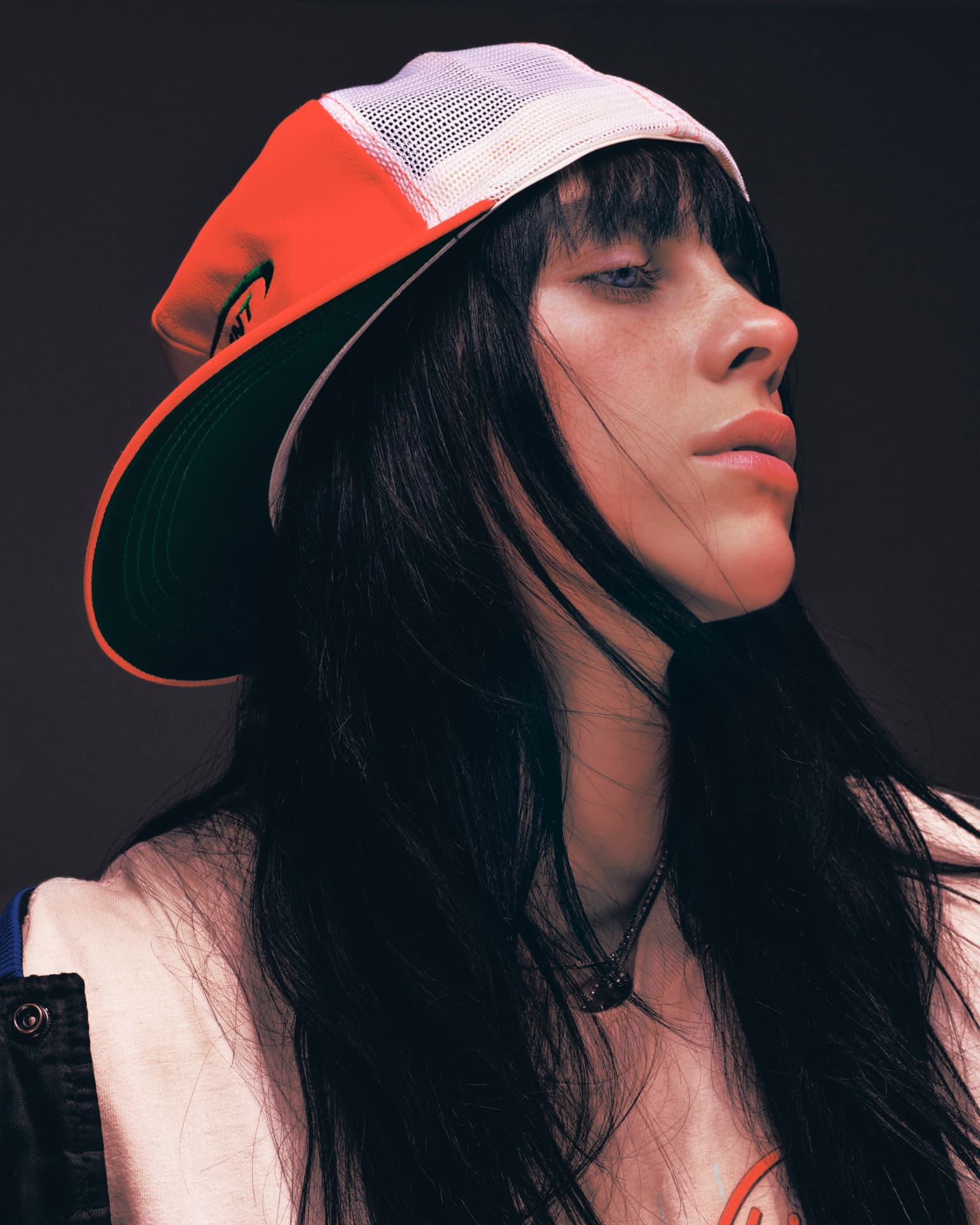 Billie Eilish portrait in red and white cap