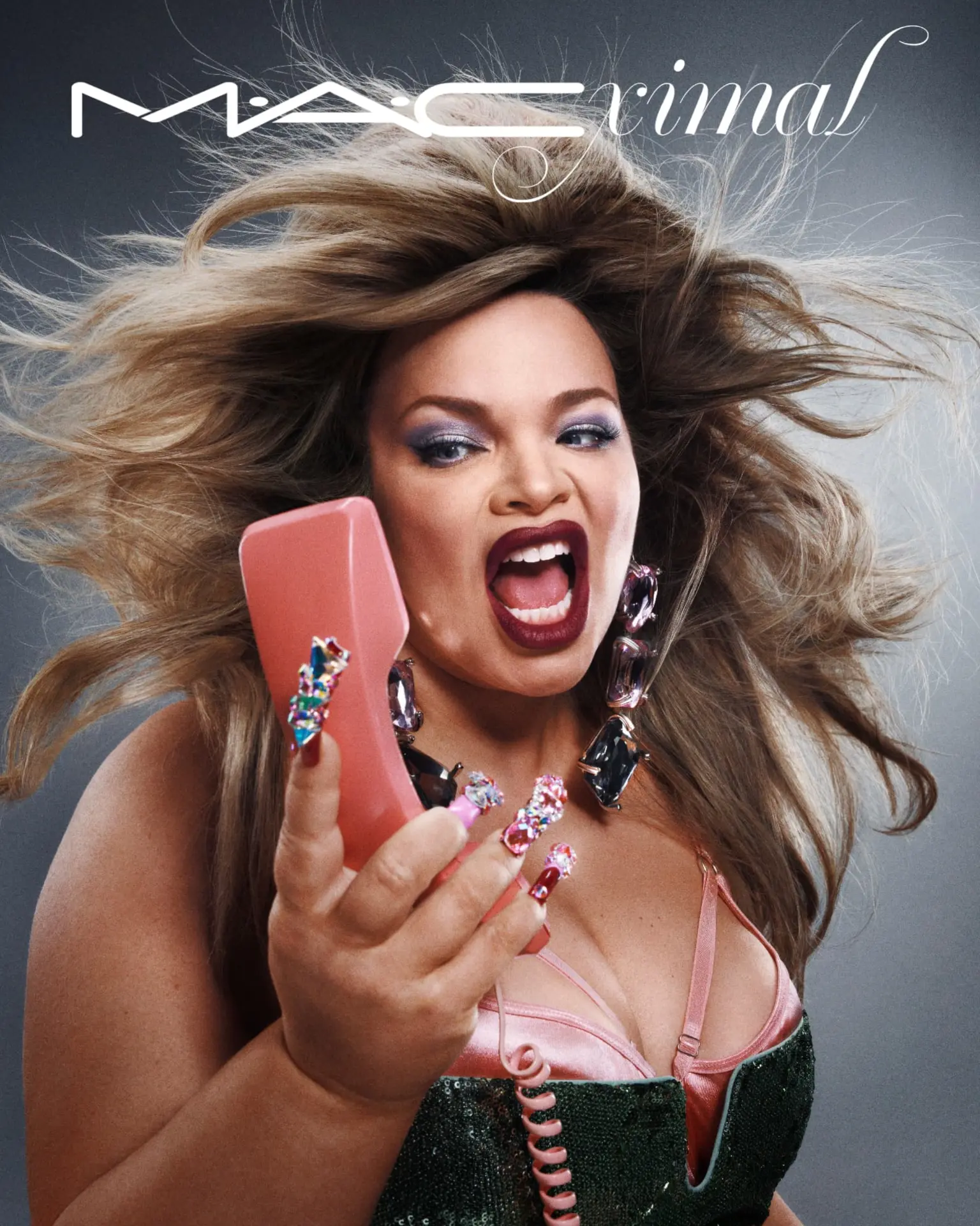 MACximal — blonde model with pink phone and green corset