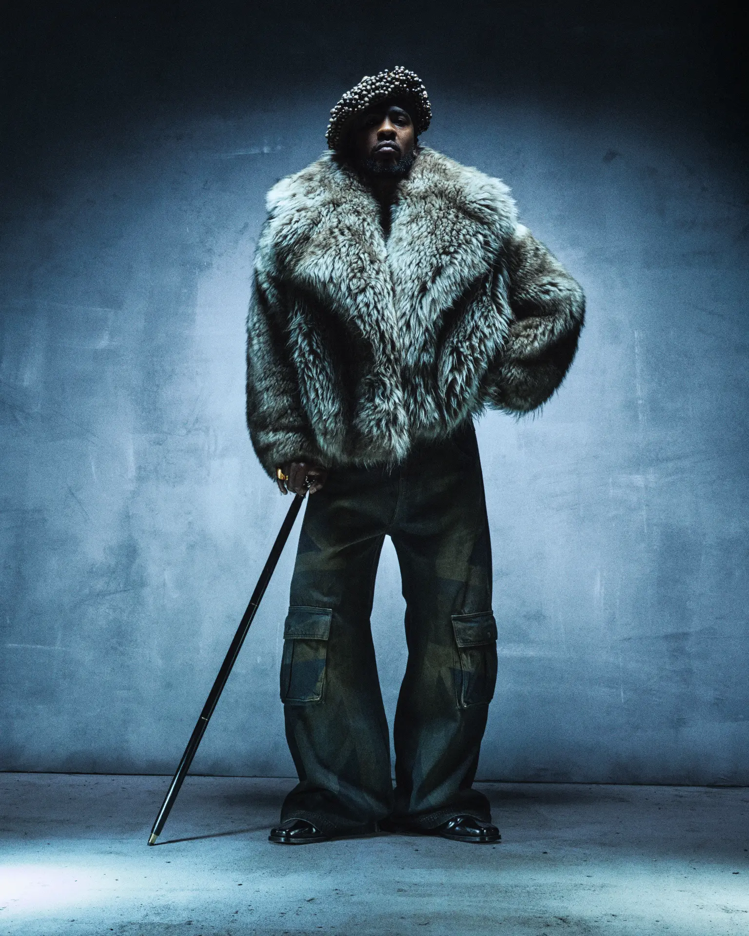 SKEPTA x GQ MOTY — standing portrait in fur coat and camouflage trousers