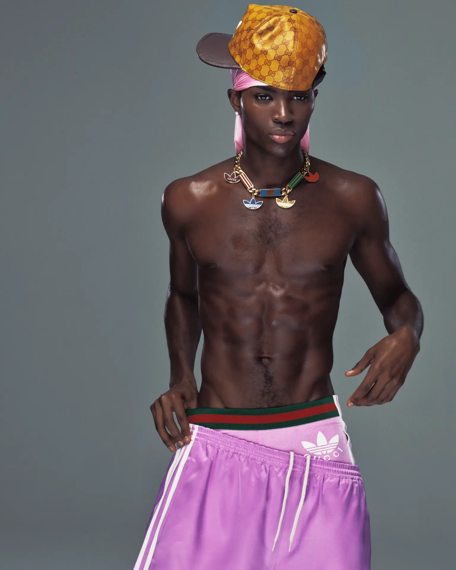 DUST Magazine — Alton Mason shirtless in pink Gucci shorts and gold cap