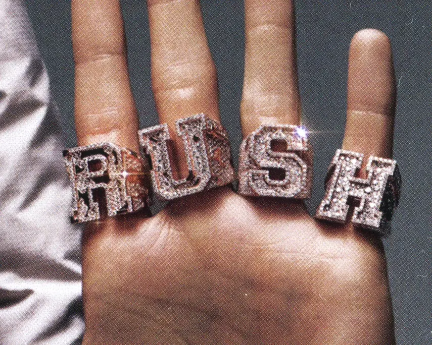 Central Cee — hand wearing iced RUSH knuckle rings