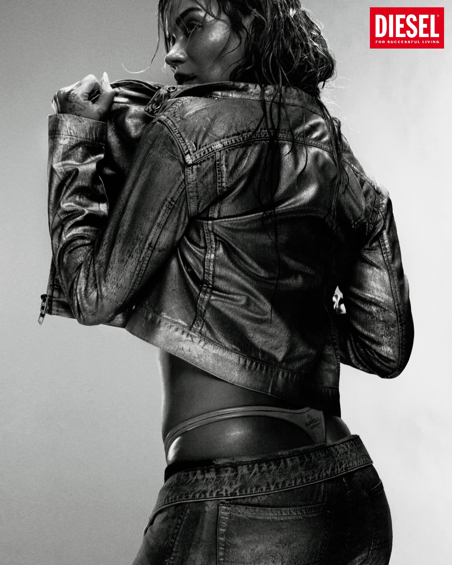 KAROL G x DIESEL — black leather jacket portrait with Diesel logo