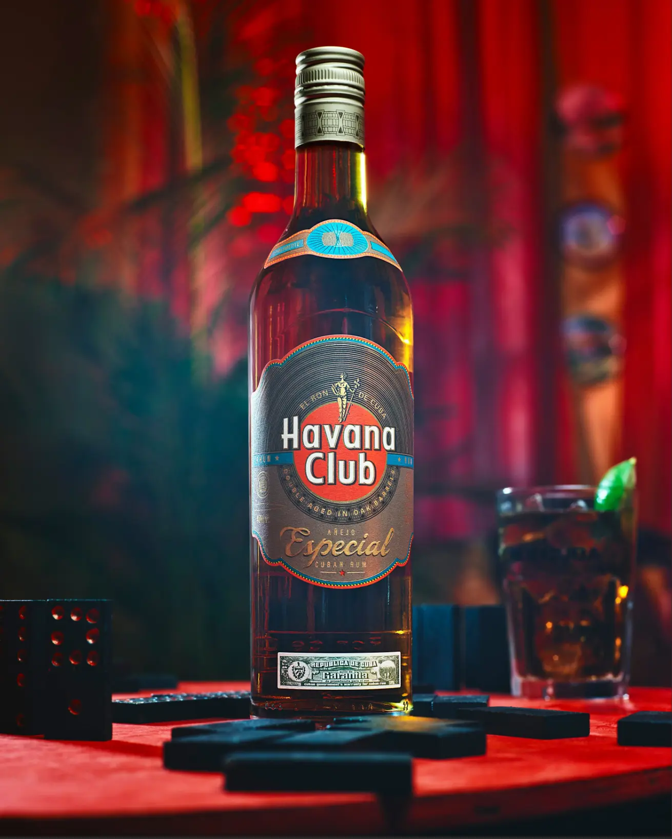 Havana Club — Añejo Especial bottle with dominoes and cocktail