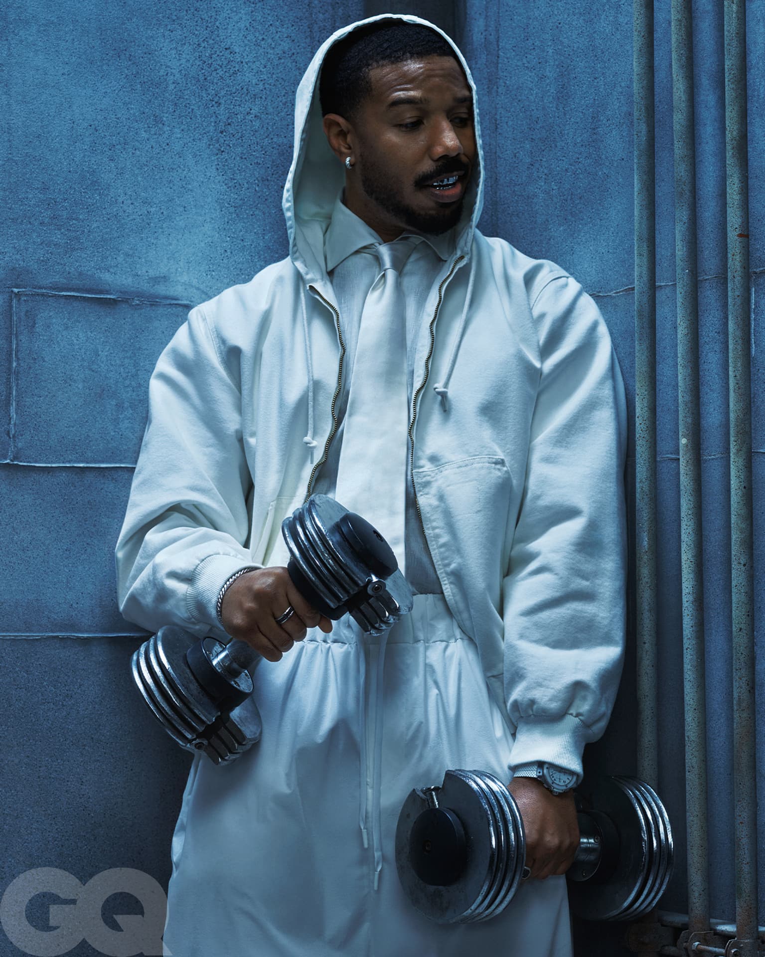 Michael B Jordan — hooded jacket with dumbbells