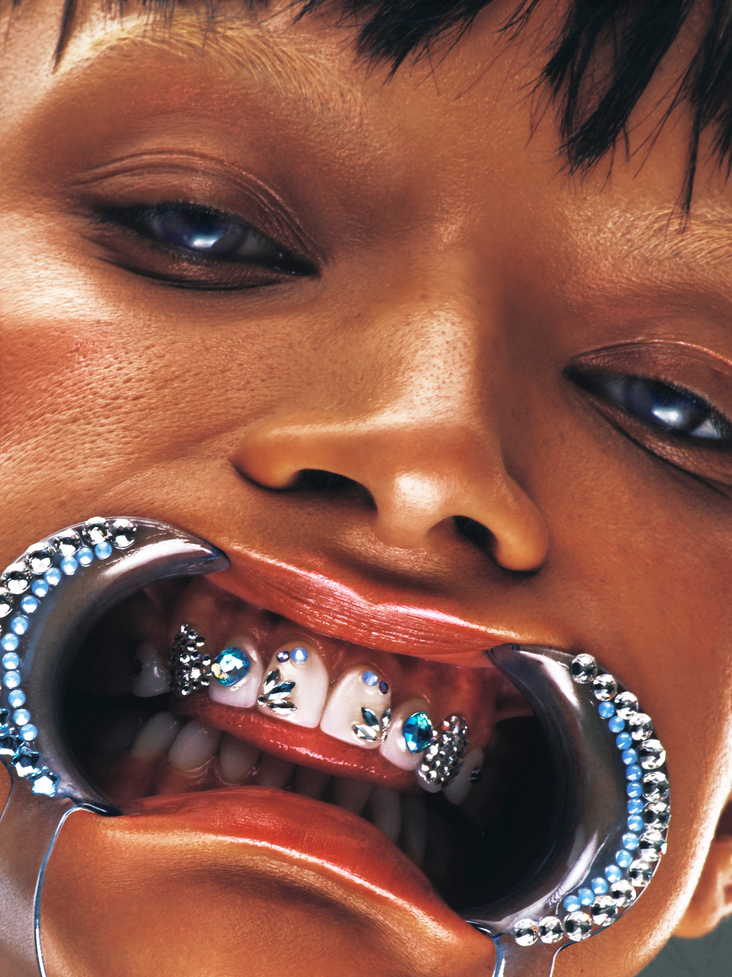 Georgia Palmer close-up portrait with jewelled mouth accessory