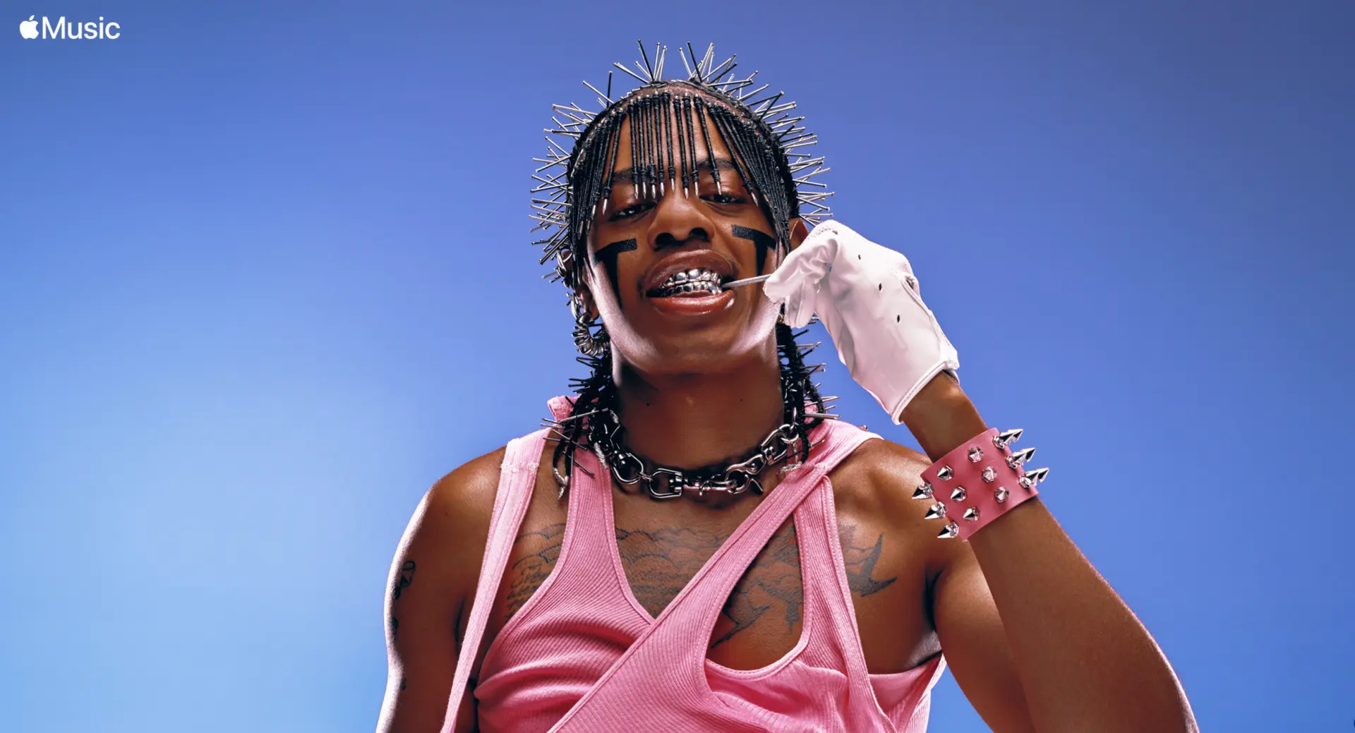 Teezo Touchdown x Apple Music — spiked hair portrait against blue sky with Apple Music logo