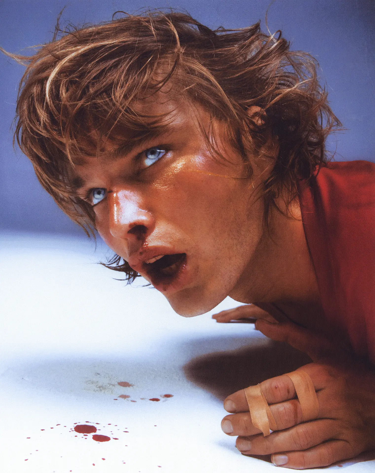 Jordan Barrett close-up portrait with red top and bandaged hand