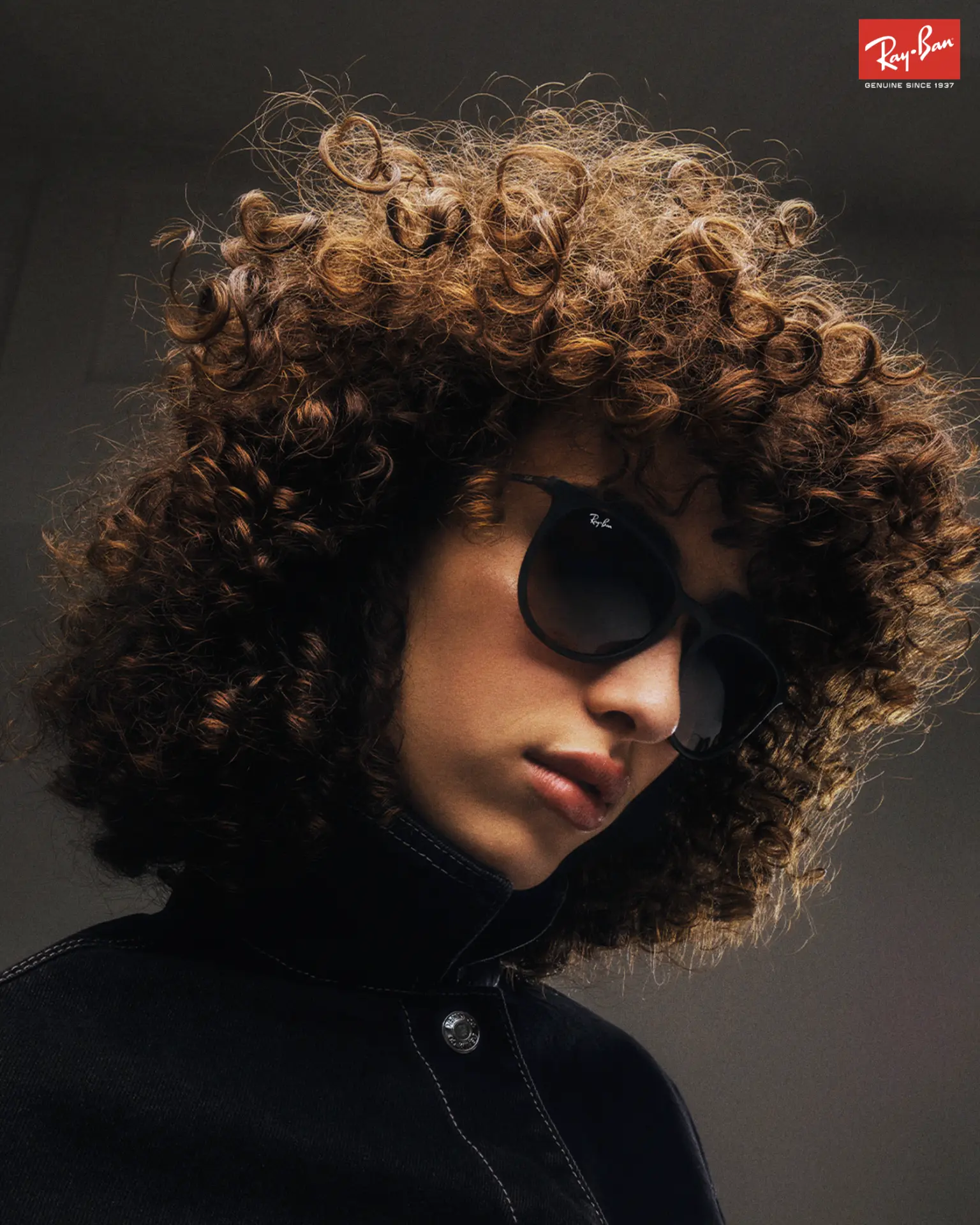 RayBan Holiday Campaign — curly-haired figure in round black sunglasses