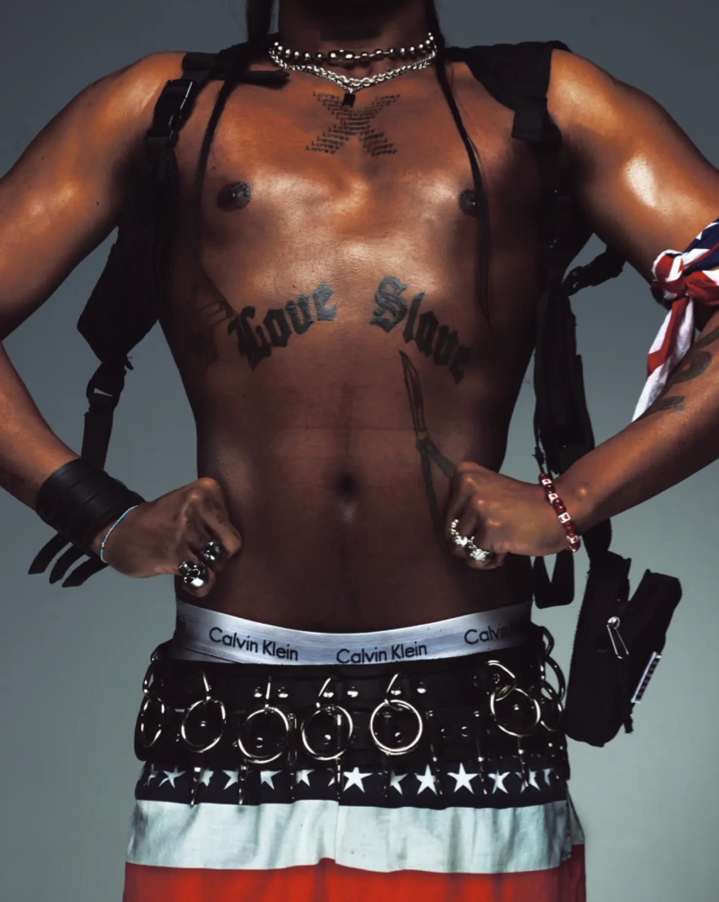 Tyga torso portrait with Calvin Klein waistband and flag skirt