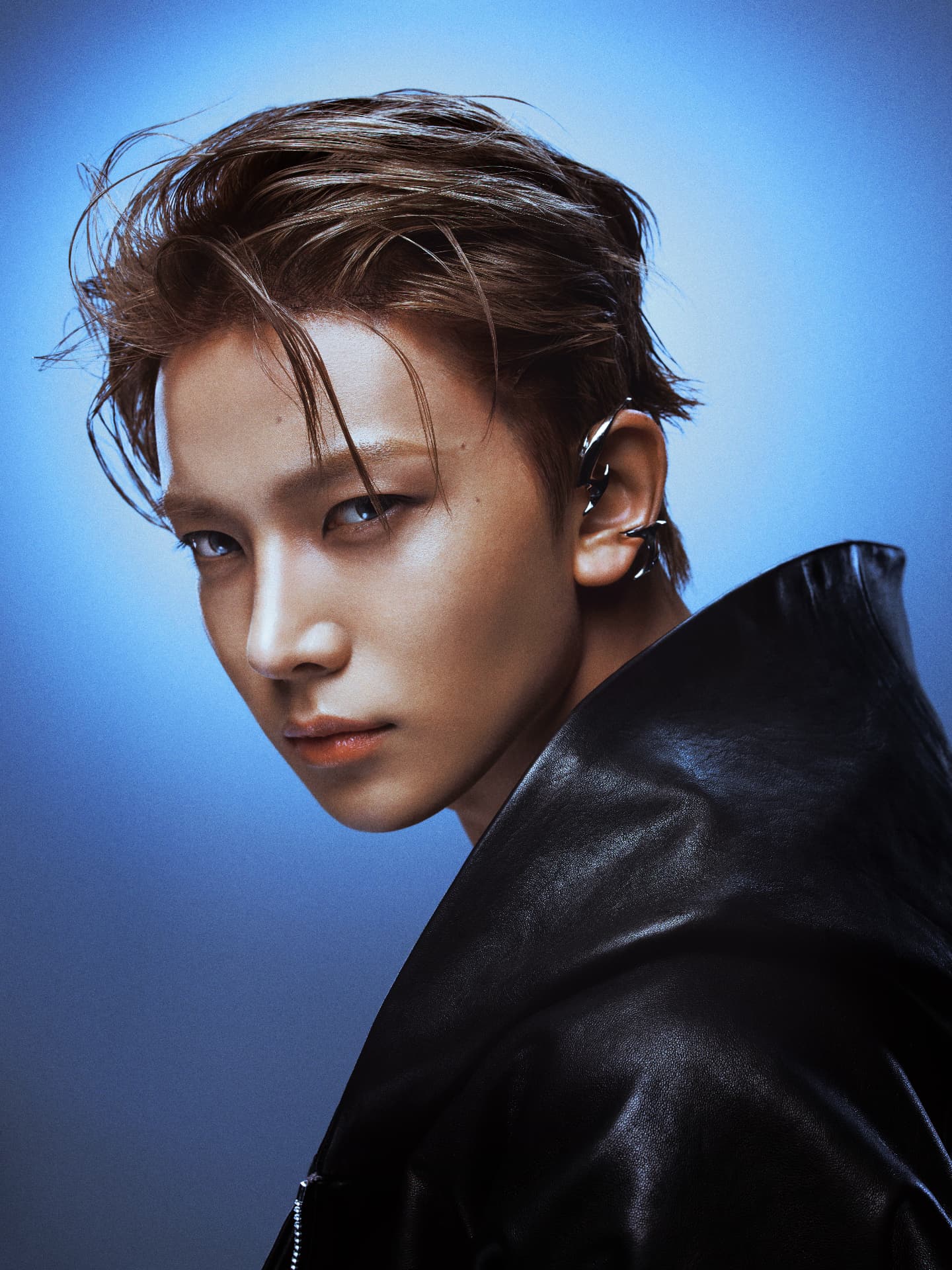 ENHYPEN — Heeseung profile portrait in black leather against blue light