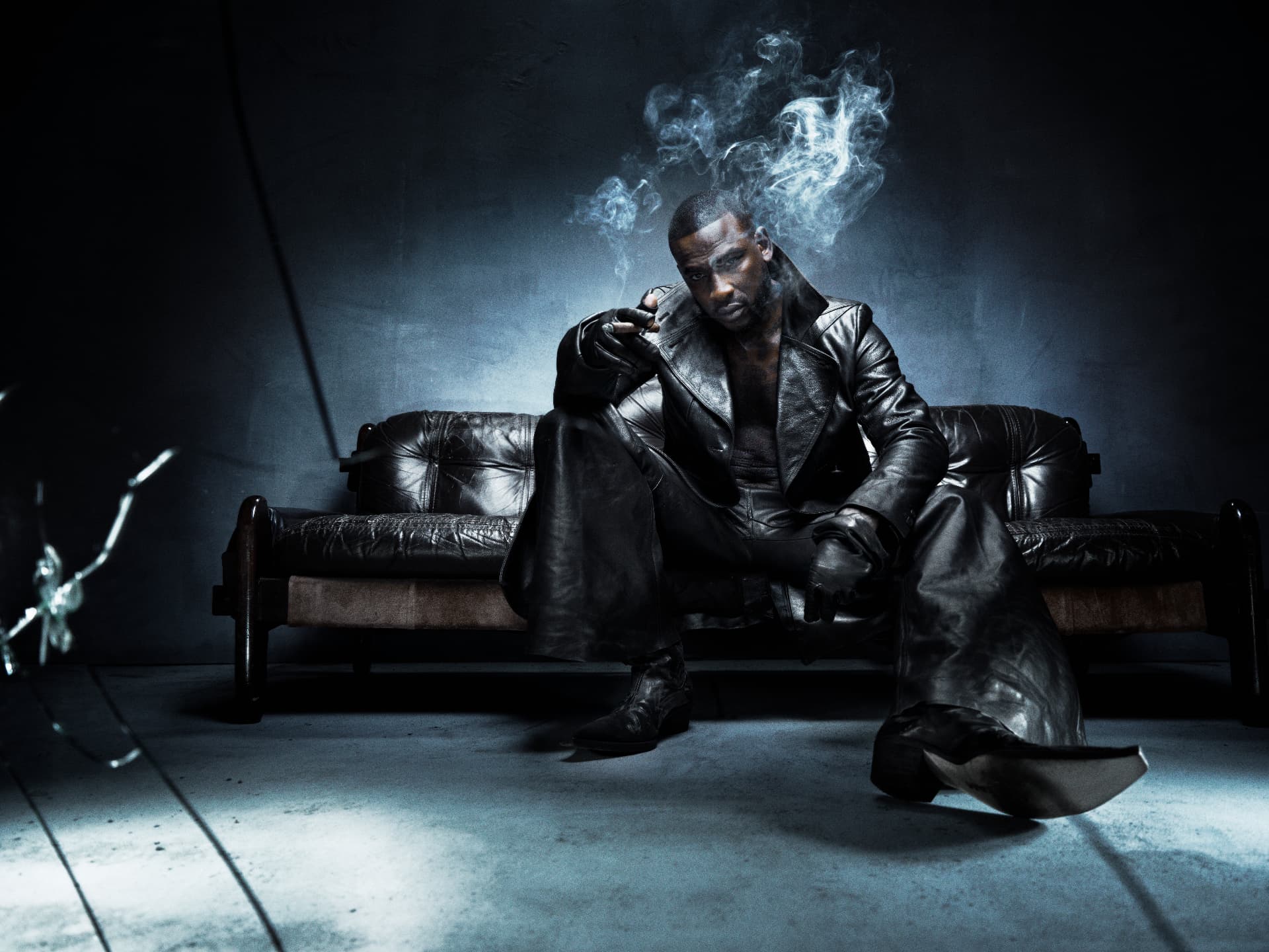 SKEPTA x GQ MOTY — seated portrait on leather sofa with smoke