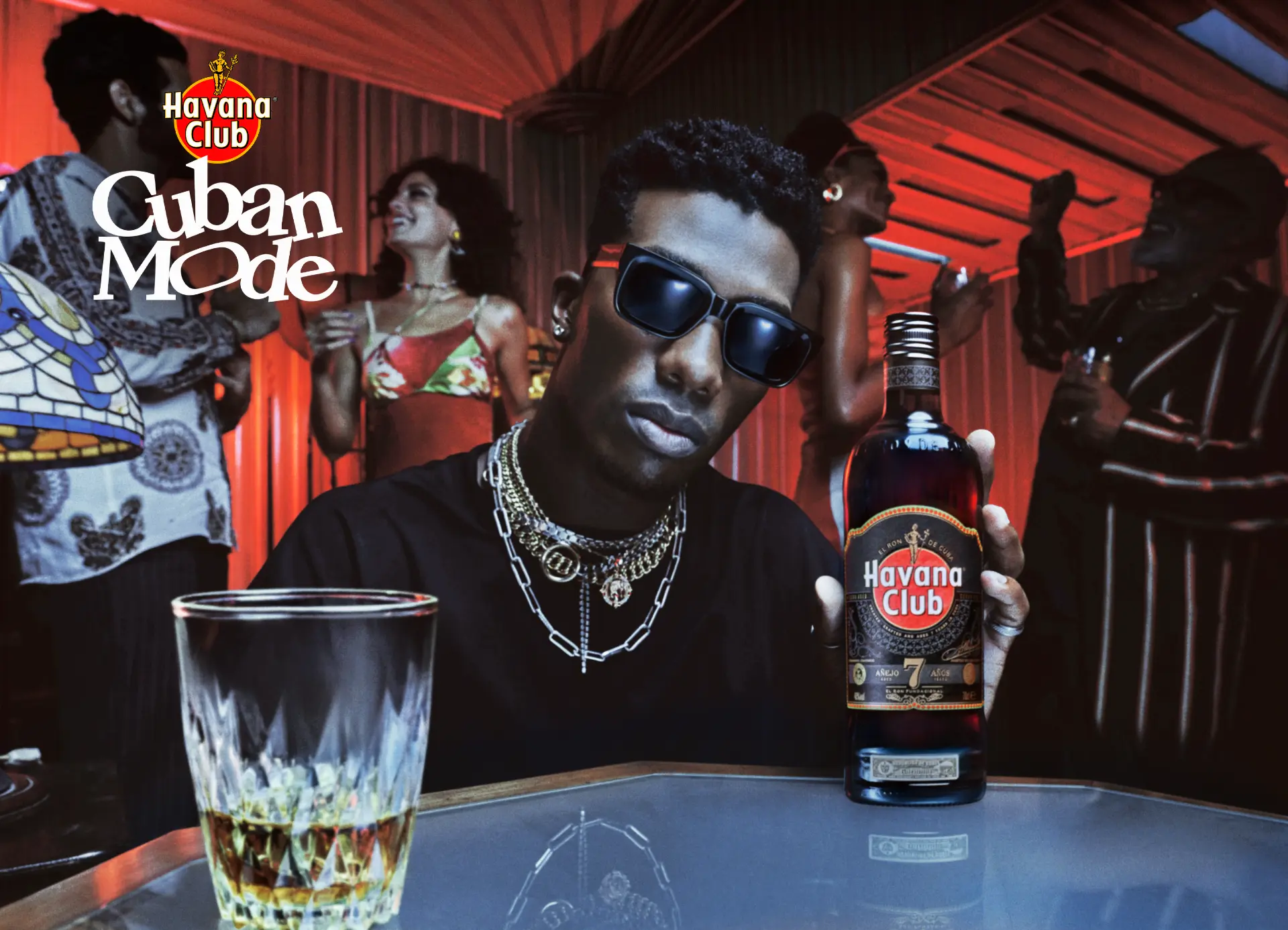 Havana Club — Spiced rum library hero with bottle and glass on red-lit table