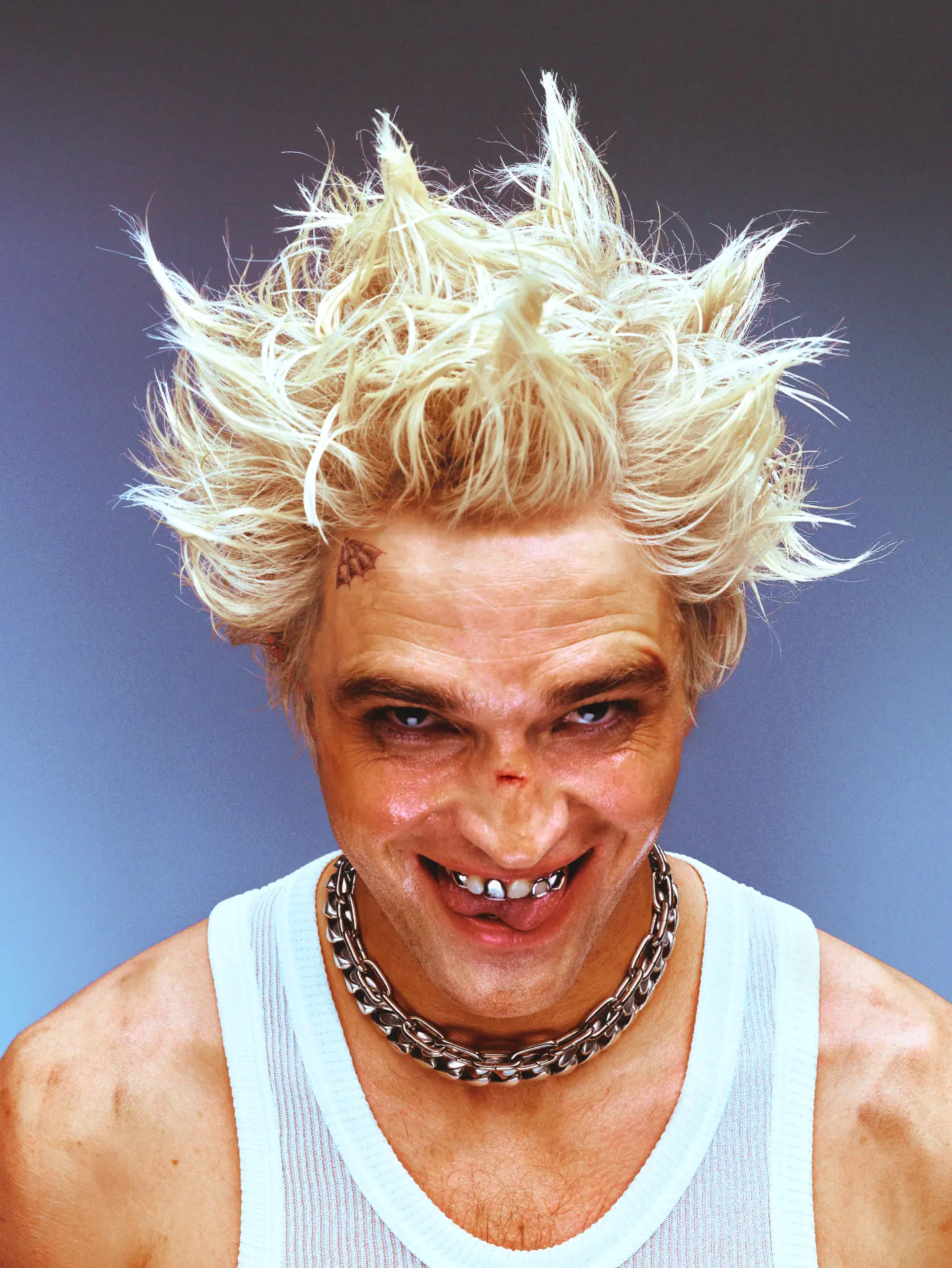 Portrait with spiky blonde hair and chain necklace