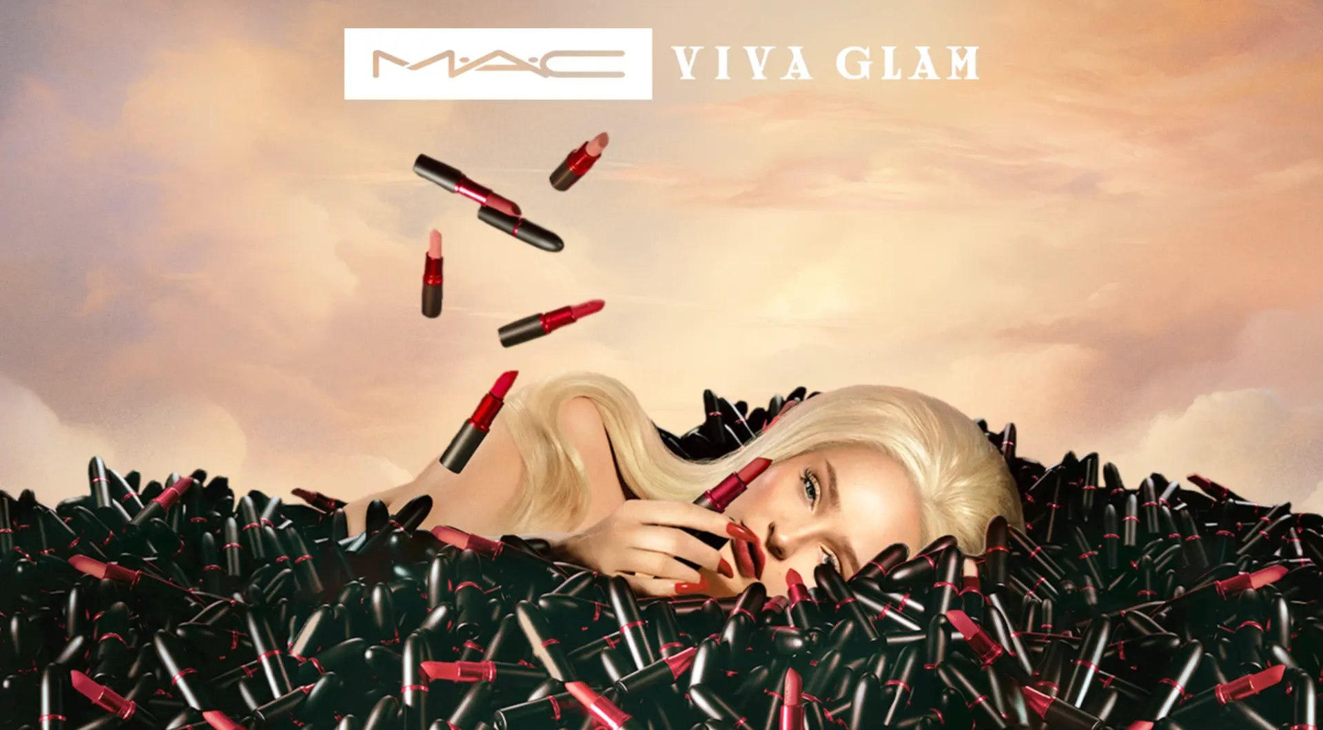 Kim Petras — MAC VIVA GLAM campaign portrait lying among lipsticks