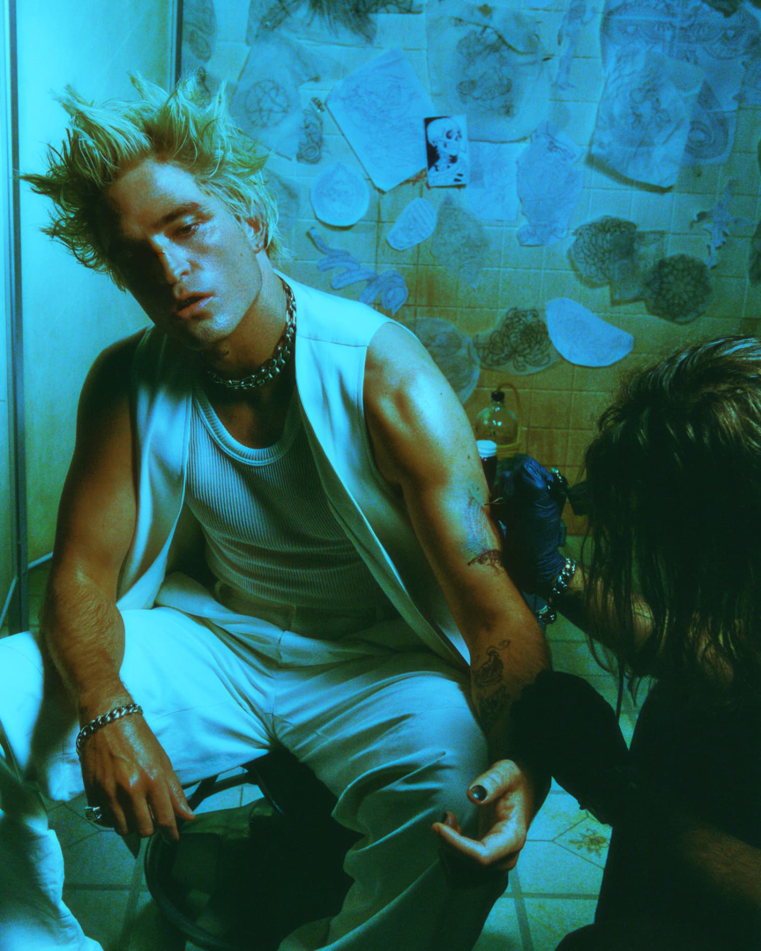 Rob Pattinson GQ — bathroom portrait in green-blue light