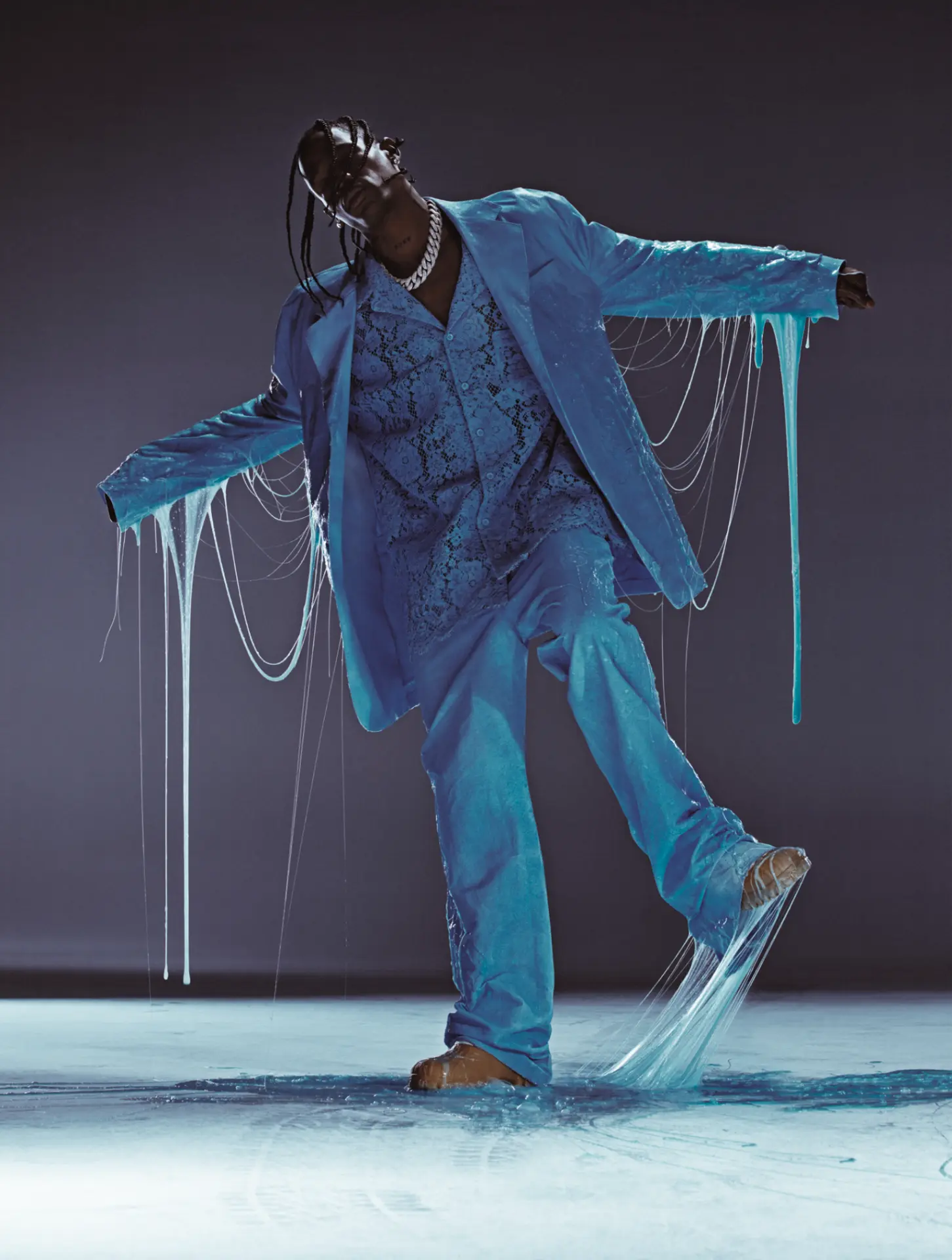 Travis Scott — blue suit with dripping slime