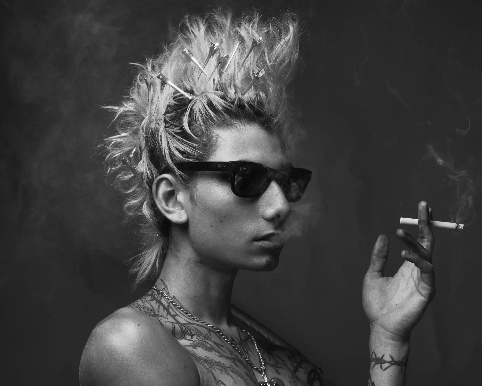 Charles portrait with spiked hair smoking a cigarette